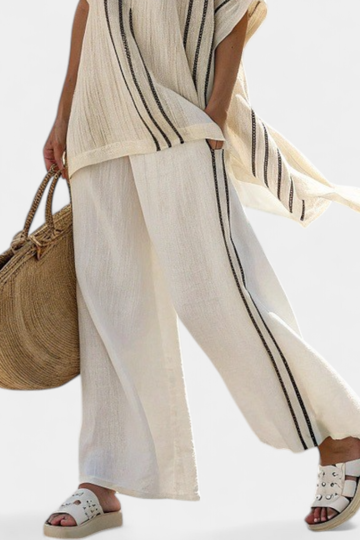 Raffaella – elegant ivory blouse and black striped pants
